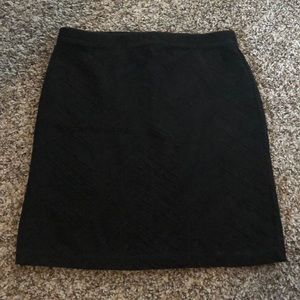Black pencil skirt. Is stretchy material.